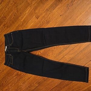 Dark blue jeans with gold stitching